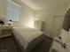 Bright bedroom with a large window and a comfortable bed, dresser and closet at 3447 Sw Covilha Ln, Henderson, NV 89044