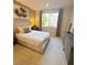 Comfortable bedroom with neutral tones, large window and stylish decor at 3447 Sw Covilha Ln, Henderson, NV 89044