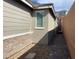 View of the side of a home exterior with brick and stucco at 3447 Sw Covilha Ln, Henderson, NV 89044