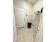 Practical laundry area with door to exterior and shelving at 3447 Sw Covilha Ln, Henderson, NV 89044