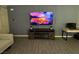 Comfortable living room features modern entertainment center and stylish gray walls at 3447 Sw Covilha Ln, Henderson, NV 89044