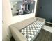Cozy living room features an off-white couch in front of a mirror at 3447 Sw Covilha Ln, Henderson, NV 89044