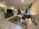 Spacious living room with neutral tones, featuring a cozy seating area and modern décor at 3447 Sw Covilha Ln, Henderson, NV 89044