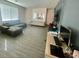 Spacious living room with a comfortable gray sofa and an additional sofa against the wall at 3447 Sw Covilha Ln, Henderson, NV 89044