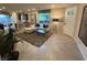 An open-concept living area with a modern kitchen and comfortable seating at 3447 Sw Covilha Ln, Henderson, NV 89044