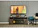 Cozy living room features a fireplace, media console, and wall-mounted TV at 3447 Sw Covilha Ln, Henderson, NV 89044