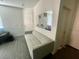 Cozy living room features an off-white couch in front of a mirror at 3447 Sw Covilha Ln, Henderson, NV 89044