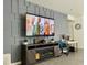 Cozy living room features a fireplace, media console, and wall-mounted TV at 3447 Sw Covilha Ln, Henderson, NV 89044