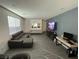 Spacious living room featuring an entertainment center and comfortable seating at 3447 Sw Covilha Ln, Henderson, NV 89044
