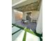 Inviting covered patio features stylish outdoor seating, string lights, and sliding glass doors at 3447 Sw Covilha Ln, Henderson, NV 89044