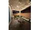 Cozy patio featuring string lights, comfortable seating, and attractive landscaping at 3447 Sw Covilha Ln, Henderson, NV 89044