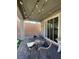 Relaxing covered patio with stylish seating and sliding glass doors at 3447 Sw Covilha Ln, Henderson, NV 89044