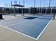 Enjoy friendly matches on the blue and gray pickleball courts with covered seating areas at 3447 Sw Covilha Ln, Henderson, NV 89044