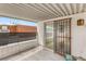 Cozy balcony features a metal security gate and a view of the neighborhood at 3471 One Nation Ave, Las Vegas, NV 89121