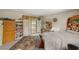 Bedroom with sliding door to balcony, built-in bookcase, and natural lighting at 3471 One Nation Ave, Las Vegas, NV 89121