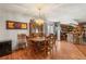 Dining room with wooden table and chairs, and a decorative chandelier at 3471 One Nation Ave, Las Vegas, NV 89121
