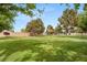 Open green space with mature trees offers a serene environment for community enjoyment at 3471 One Nation Ave, Las Vegas, NV 89121