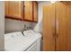 Functional laundry room with washer, dryer, and storage cabinets at 3471 One Nation Ave, Las Vegas, NV 89121