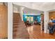 Inviting living room with a staircase, hardwood floors, and a bright color scheme at 3471 One Nation Ave, Las Vegas, NV 89121