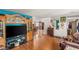 Open concept living area with hardwood floors, and entertainment center at 3471 One Nation Ave, Las Vegas, NV 89121