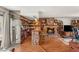 Living room features a stone fireplace, bar with seating, and a glass sliding door at 3471 One Nation Ave, Las Vegas, NV 89121