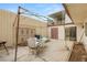 Back patio with overhead shade structure and outdoor furniture at 3471 One Nation Ave, Las Vegas, NV 89121