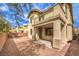 A backyard with gravel, brick, and patio at 3725 Moonshine Falls Ave, North Las Vegas, NV 89085