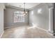 Inviting dining room with tile floors, a chandelier, and natural light at 3725 Moonshine Falls Ave, North Las Vegas, NV 89085