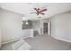 Carpeted loft area with ceiling fan, open staircase and views of the stairway at 3725 Moonshine Falls Ave, North Las Vegas, NV 89085