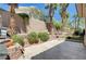 Well-maintained backyard with desert landscaping, planters, and hardscape at 3873 Palm Island Ct, Las Vegas, NV 89147