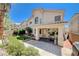 Backyard view highlighting the patio, landscaping, and the rear of the house at 3873 Palm Island Ct, Las Vegas, NV 89147