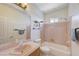 Bathroom featuring a single sink vanity and a tub with a shower at 3873 Palm Island Ct, Las Vegas, NV 89147