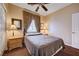 Bedroom with queen bed and patterned curtains at 3873 Palm Island Ct, Las Vegas, NV 89147