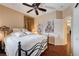 Bedroom with bed, ceiling fan, wall art, and neutral walls at 3873 Palm Island Ct, Las Vegas, NV 89147