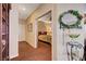 Hallway to guest bedroom features hardwood floors and neutral walls at 3873 Palm Island Ct, Las Vegas, NV 89147