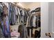 Walk-in closet filled with clothes and storage solutions at 3873 Palm Island Ct, Las Vegas, NV 89147