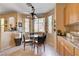 Cozy eat-in kitchen area with lots of natural light and a quaint glass dining table at 3873 Palm Island Ct, Las Vegas, NV 89147