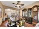 Grand dining area with ornate wood furnishings and elegant decor, perfect for entertaining at 3873 Palm Island Ct, Las Vegas, NV 89147