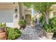 Inviting entrance with a stone walkway, a decorative fountain, and a tiled entrance at 3873 Palm Island Ct, Las Vegas, NV 89147
