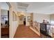 Second story hallway with wood floors and view of an office at 3873 Palm Island Ct, Las Vegas, NV 89147