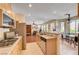 Open kitchen featuring stainless steel appliances, tile floors and views to the living area at 3873 Palm Island Ct, Las Vegas, NV 89147