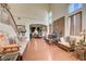 Open-concept living room with lots of natural light, hardwood floors, and elegant decor at 3873 Palm Island Ct, Las Vegas, NV 89147