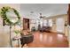 Bright living room with a fireplace, cozy seating, and a sliding door to outdoor access at 3873 Palm Island Ct, Las Vegas, NV 89147