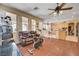 Open concept living space with hardwood floors, lots of natural light, and access to the kitchen at 3873 Palm Island Ct, Las Vegas, NV 89147