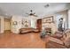 Spacious living room featuring fireplace, hardwood floors, and comfortable seating at 3873 Palm Island Ct, Las Vegas, NV 89147