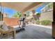 Covered patio featuring a treadmill and outdoor seating at 3873 Palm Island Ct, Las Vegas, NV 89147