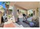 Outdoor covered patio area with a treadmill, heater, and patio furniture at 3873 Palm Island Ct, Las Vegas, NV 89147
