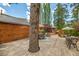 Charming back deck with outdoor dining set and built-in tree feature at 3935 White Fir Way, Mount Charleston, NV 89124