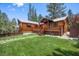 Beautifully maintained lawn leading to a deck, providing an outdoor retreat at 3935 White Fir Way, Mount Charleston, NV 89124