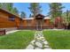 Inviting home with a lush green lawn and a flag pole for added charm at 3935 White Fir Way, Mount Charleston, NV 89124